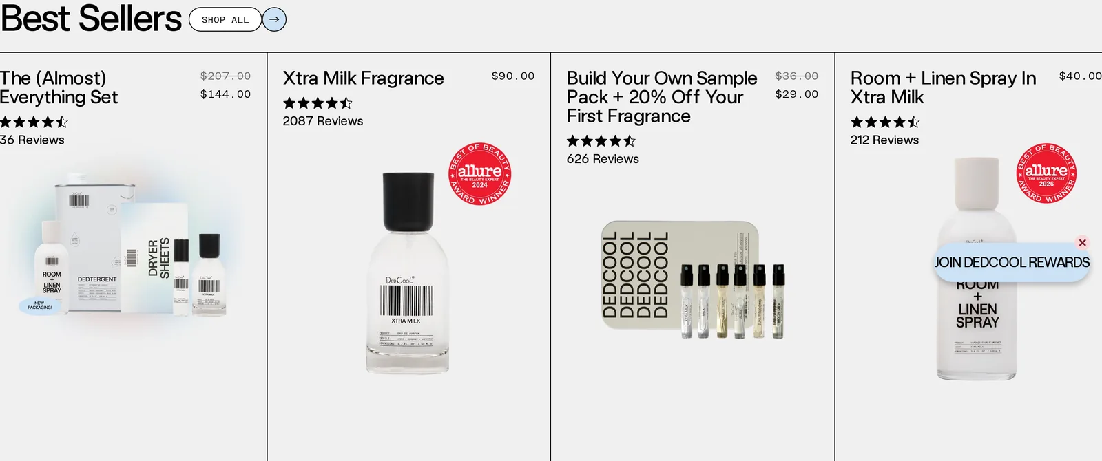 DedCool homepage Best Sellers row with the Almost Everything Set, Xtra Milk Fragrance with an Allure Best of Beauty 2024 seal, the sample pack and the Room and Linen Spray with an Allure Best of Beauty 2026 seal