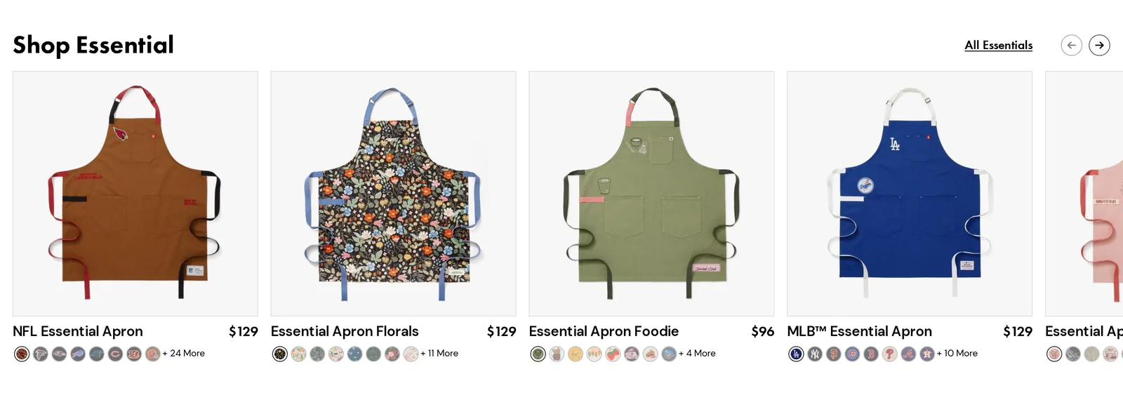 Shop Essential row on the Midnight Blue Essential Apron page with an NFL Essential Apron at $129, Essential Apron Florals at $129, Essential Apron Foodie at $96 and an MLB Essential Apron