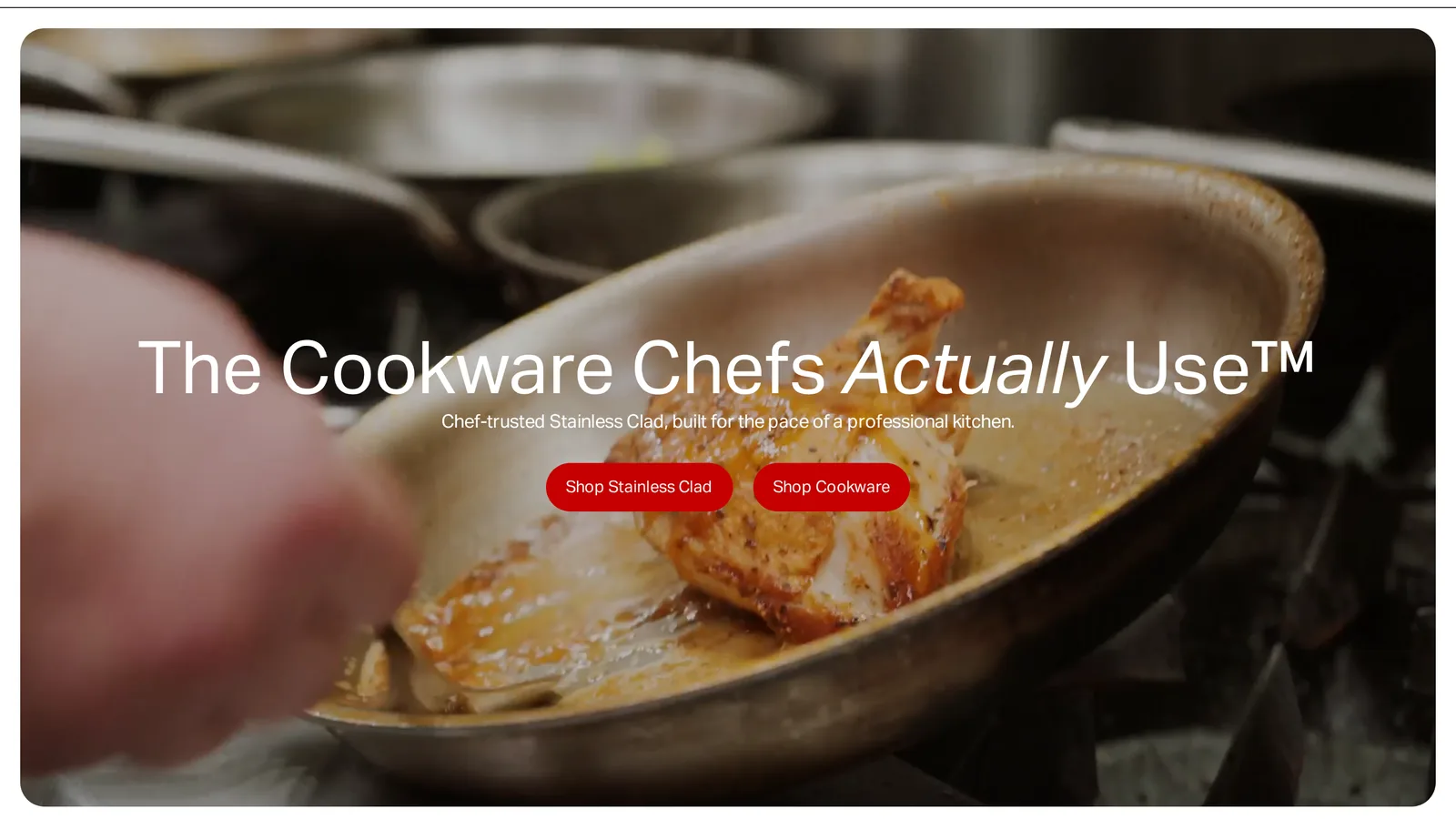 Made In homepage hero with the headline The Cookware Chefs Actually Use, a small subhead and two red buttons, Shop Stainless Clad and Shop Cookware, over a video of a pan